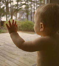 baby looking thru window